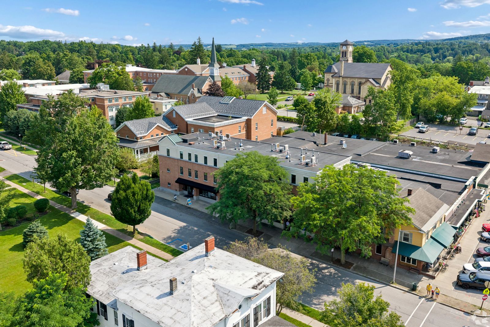 Aerial view of downtown Cazenovia village with church steeples and tree-lined streets